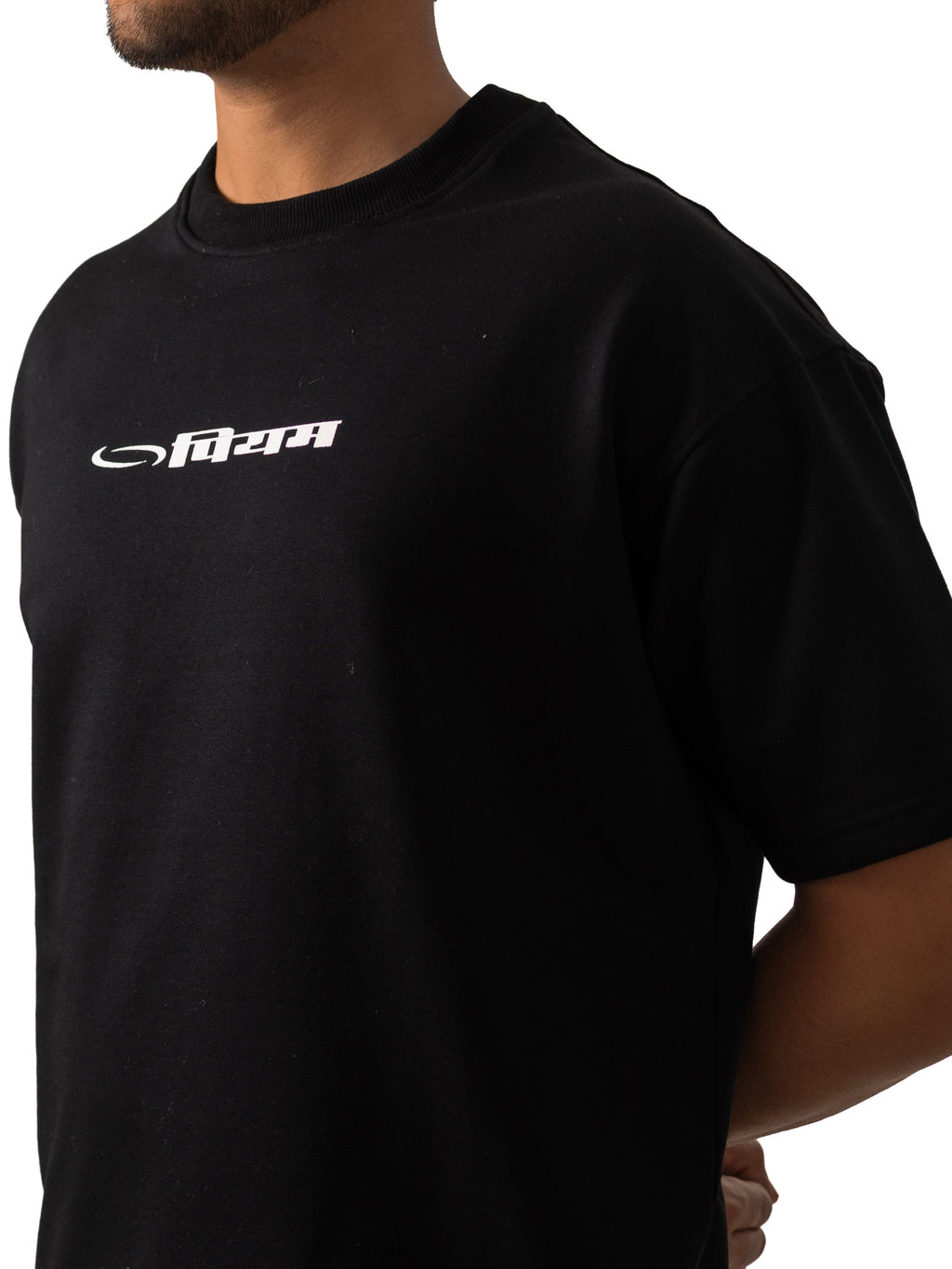 Person wearing a black t-shirt with a logo on a white background