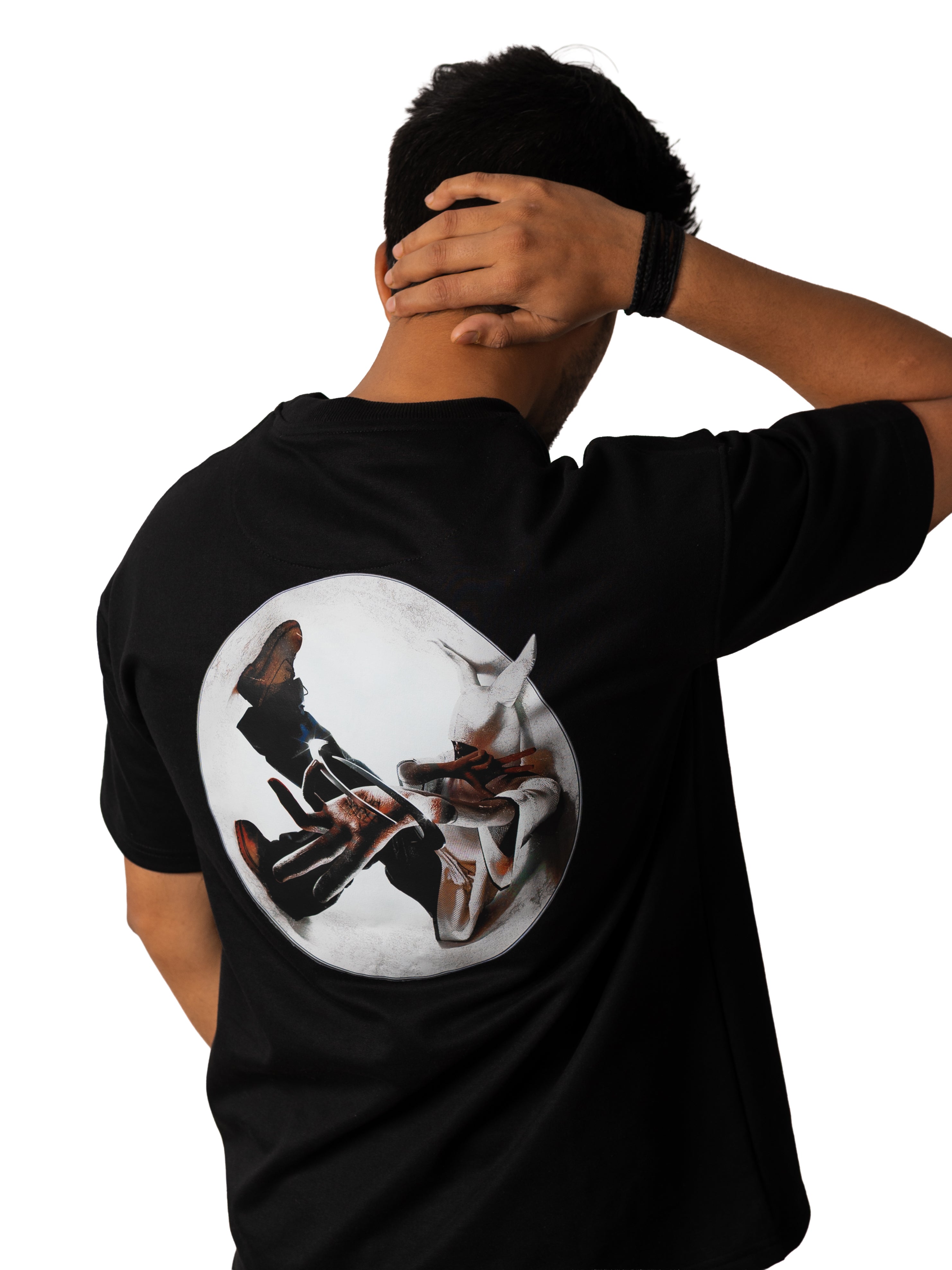 Person wearing a black t-shirt with a graphic design on a white background